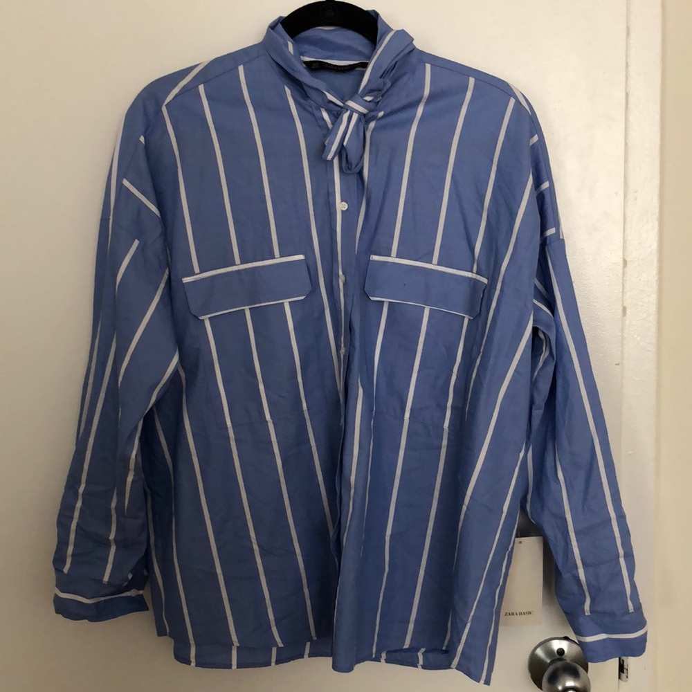 Button down shirt with bow detail.